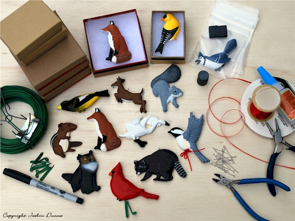 Finishing Evergreen Classics wildlife and animal keepsake ornaments.